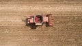 Aerial view combine, harvester, harvesting on sunflower field. Mechanized harvesting sunflower Royalty Free Stock Photo