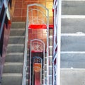 Top-Down View of Concrete Stairs, Metal Handrails in High-Rise Residential Building. Emergency Exit Concept Royalty Free Stock Photo