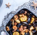 Top down view of a gourmet New England clam bake in roasting pan ready for serving. Royalty Free Stock Photo