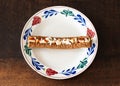 Frikandel speciaal, a popular dutch fast food snack consisting of minced meat sausage, mayonnaise, curry and chopped raw onion