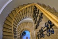 Top down view of elegant, golden, spiral staircase Royalty Free Stock Photo