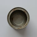 A top-down view of an empty, open metal can with a slightly rusted interior and Royalty Free Stock Photo