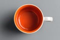 Top Down View of Empty Orange and White Coffee Mug Royalty Free Stock Photo