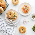 Top down view of everything bagels topped with cream cheese, smoked salmon lox and garnished with capers and sprouts. Royalty Free Stock Photo