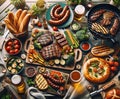 Top-down view of a Father's Day BBQ, featuring marinated steaks, grilled vegetables, Italian sausages, focaccia, and Royalty Free Stock Photo