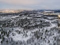 Top down view of forest in winter and city murmansk. Winter landscape in the forest. Flying over winter fir forest. Top down view Royalty Free Stock Photo