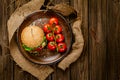 Top down view of fresh homemade beef burger on rustic wooden serving table. Homemade cooking Royalty Free Stock Photo