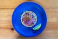 Top down view of fresh Mexican tuna tostada with cabbage and lime