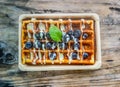 A top-down view of a freshly made waffle