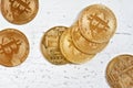 Top down view, golden commemorative btc - bitcoin cryptocurrency - coins scattered on white stone board, closeup detail