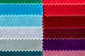 Top down view of gradient colored fabric velvet samples with jagged edges