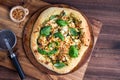 A homemade pesto and greens gourmet pizza garnished with basil and chilis. Royalty Free Stock Photo