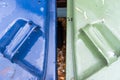 Top down view of household blue and green waste bins.