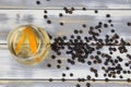 Top down view on isolated cocktail glass with gin tonic orange fruit slices and juniper berries on white wood planks table Royalty Free Stock Photo