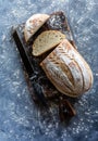 Top down view of a loaf of sourdough bread that has been sliced into.