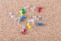 Top down view multicolored thumb tacks lying on a cork board Royalty Free Stock Photo