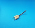 Top down view of an old unused plastic plug with broken plastic parts and a cut wire Royalty Free Stock Photo