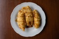 Top down view of pisang goreng (fried banana) on a white plate