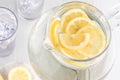 A top down view of a pitcher of lemon water with lemon slices ready for drinking. Royalty Free Stock Photo