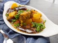 Top down view of a plate of Gluten free and vegan Eggplant and Potato curry or fry