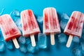 Top down view of popsicles and ice cubes against blue backdrop Royalty Free Stock Photo