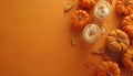 A top-down view of pumpkins and lattes on an orange backdrop, with space for text Royalty Free Stock Photo