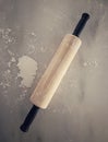 Top down view of rolling pin on floured marble surface. Royalty Free Stock Photo