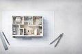 Top-down view of a roofless house model showing interior layout on architectural blueprint Royalty Free Stock Photo