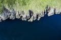 Top down view on rough coast line with green fields and cliffs by the ocean. Nobody. West of Ireland Royalty Free Stock Photo