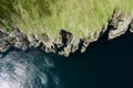 Top down view on rough coast line with green fields and cliffs by the ocean. Nobody. West of Ireland Royalty Free Stock Photo