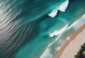 Top down view of sandy beach and turquoise sea waves at the beach