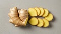 Fresh Ginger Root and Slices on Grey Background, Top View Royalty Free Stock Photo