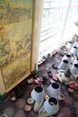 Top down view of sitting area with arm chairs, colourful carpet and a painting on the wall