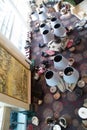 Top down view of sitting area with arm chairs, colourful carpet and a painting on the wall