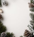Top-down view of snow-dusted pinecones, ornaments, and fir branches framing a square, light gray background with central copy Royalty Free Stock Photo