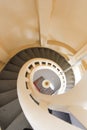 Top down view of spiral staircase with cream painted stone Royalty Free Stock Photo