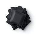 Pile of Blank Black Sachets on White Background Royalty Free Stock Photo