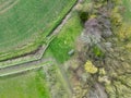 Top down view of stones and a central market depicting which shows a generic greenwich meridian marker, looking like a smiley fac