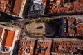 Top down view of town square in Lisbon, Portugal. Decorative tiled ground with ornaments and statue on octagonal