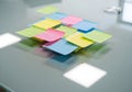 Top-down view of transparent sticky notes layered on glass desk surface with natural reflections and clean lighting in modern Royalty Free Stock Photo