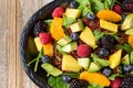 top down tropical salad, spinach, fruit quinoa