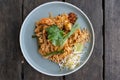 Top down view of a vegetarian pad thai dish (Thai stir fried noodles) on a blue plate Royalty Free Stock Photo