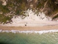 Top down view of waves breaking in the sand, flying over tropical sandy beach and waves Royalty Free Stock Photo