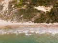 Top down view of waves breaking in the sand, flying over tropical sandy beach and waves Royalty Free Stock Photo