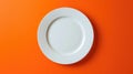Top-down view of a white empty plate placed on a vibrant orange background, creating a striking contrast, Ai Generated Royalty Free Stock Photo