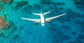 Top down view of white plane flying over blue sea, ocean, travel, vacation concept - AI generated image Royalty Free Stock Photo