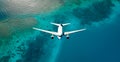 Top down view of white plane flying over blue sea, ocean, travel, vacation concept - AI generated image Royalty Free Stock Photo