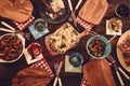 Top down view on wooden plates with food dishes Royalty Free Stock Photo