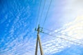 The top of electric pole on blue sky background