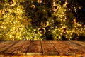 Top of empty wood table with beautiful Christmas tree and lights backdrop. Royalty Free Stock Photo